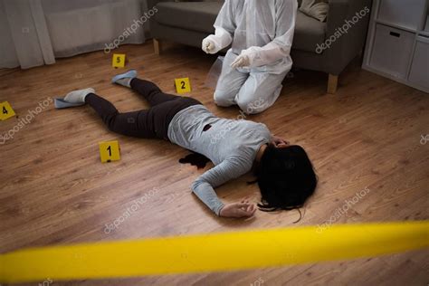 Criminalist collecting evidence at crime scene — Stock Photo © Syda ...