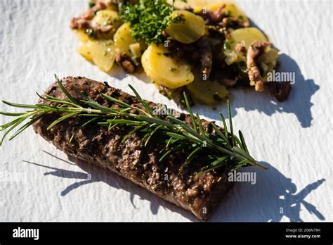 Rosemary lamb steaks with garlic Stock Photo - Alamy