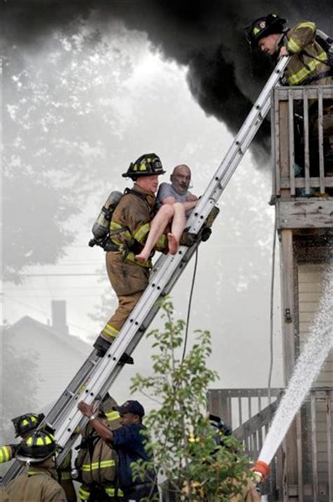 Racine Firefighters Rescue Pete Lui From Balcony of Burning Home