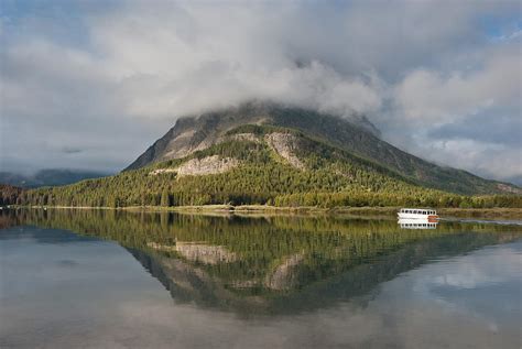 Tour Boat on Swiftcurrent Lake Photograph by Greg Nyquist | Fine Art ...