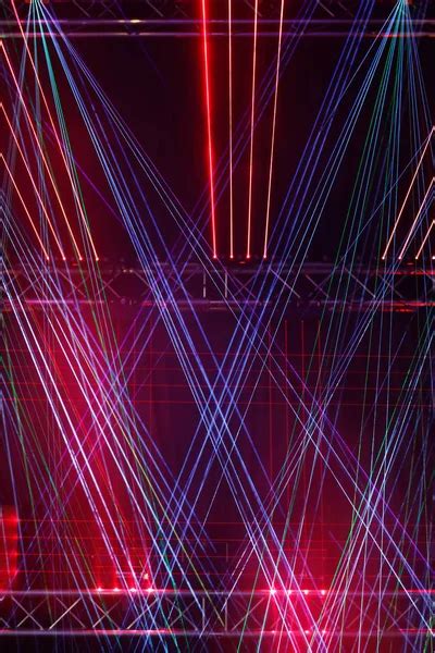 multicolored laser beam stage lights - Stock Image - Everypixel