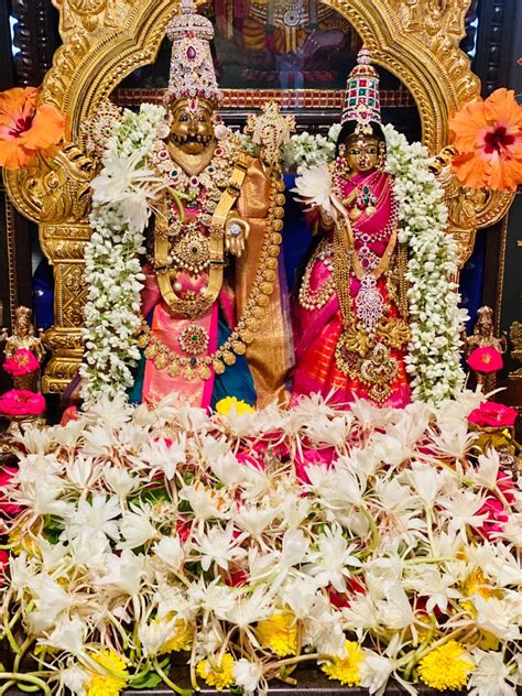 an idol is displayed in front of some flowers