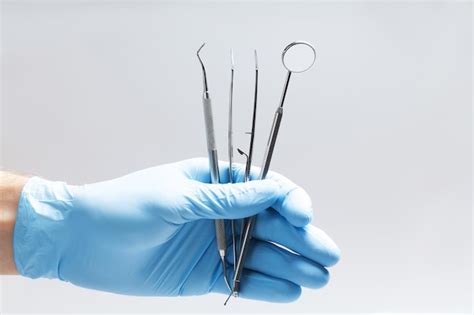 Premium Photo | Dental instruments on hand