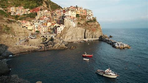 Premium Photo | View of manarola at sunset in italy