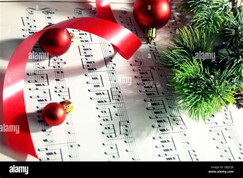 Christmas decor on music notes background Stock Photo - Alamy