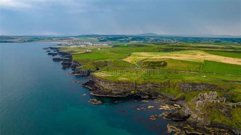 Aerial View of the Historic Dunluce Castle and the Green Fields ...