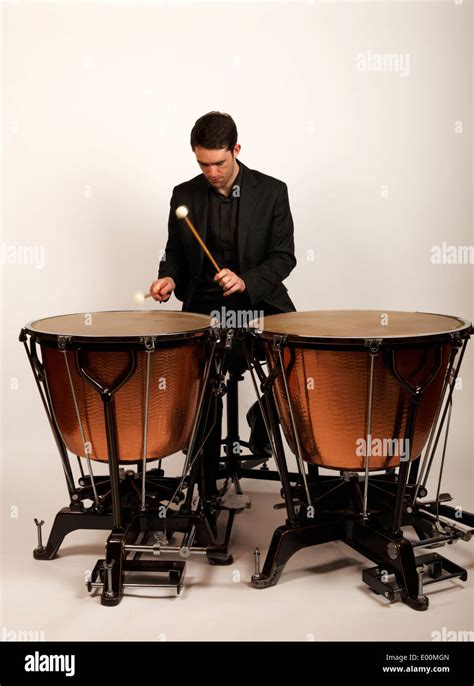 Timpanist with a timpani and timpani sticks Stock Photo - Alamy