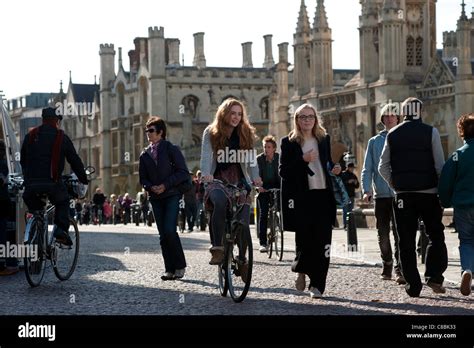 Cambridge University students cycle past Kings College, Cambridge ...