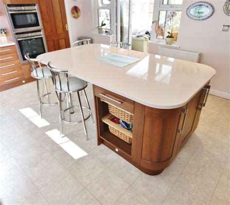 This island has curved units, to soften the island, and the worktop mimics the shape. This ...