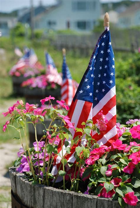 Flags | American flags decorate flower buckets on the 4th of… | Flickr