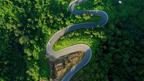 Drone Flying Above Winding Road During Stock Footage Video (100% Royalty-free) 1096612823 ...