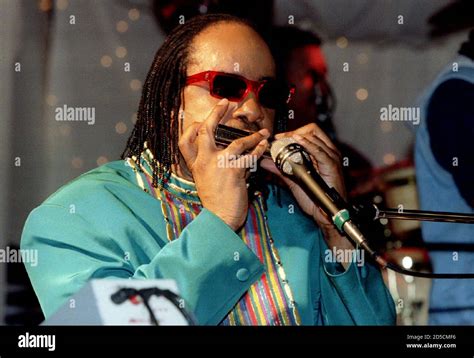 Recording artist Stevie Wonder plays his harmonica as he performs a ...