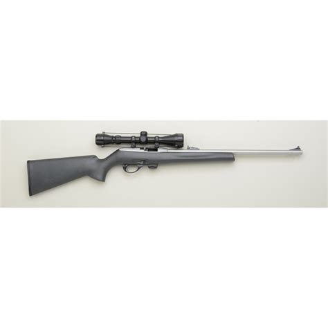 Remington Model 597 .22 caliber semi-automatic rifle with Tasco 3x9 power scope. Fine to excellent