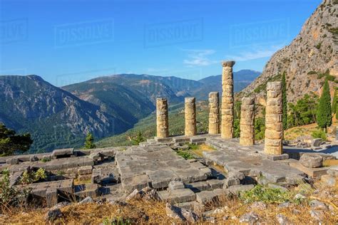 Greece. Delphi. Ancient ruins on a background of sunny mountains and ...