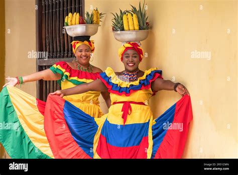 Happy, smiling Palenquera fresh fruit street vendors in the Old Town of ...