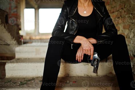 Sexy FBI female agent at abadoned place. 8644400 Stock Photo at Vecteezy