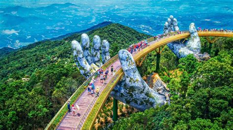 Enormous stone hands hold up Vietnam’s new golden mountain bridge ...