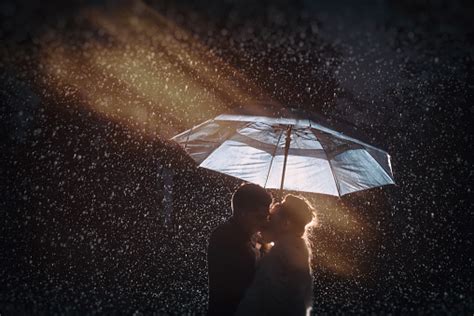 Kissing In The Rain Stock Photo - Download Image Now - iStock