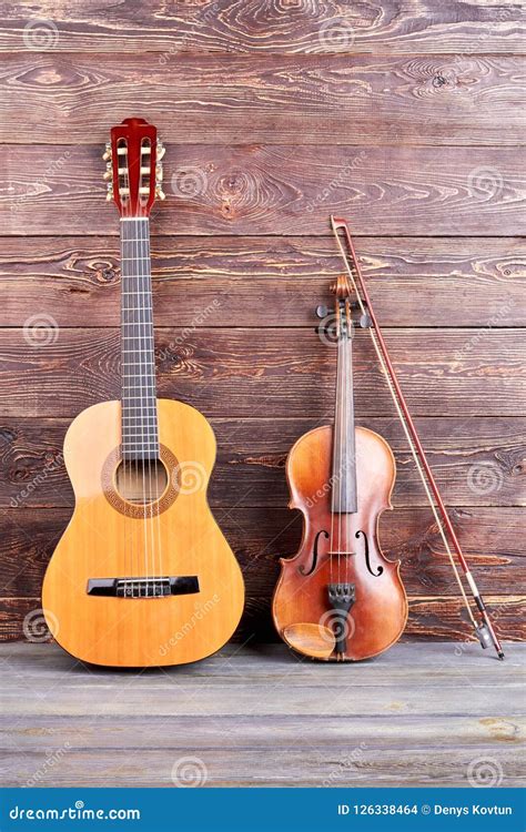 Guitar and Violin on Wooden Background. Stock Photo - Image of cello ...