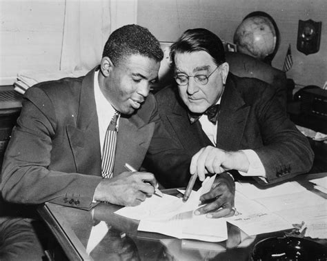 Sold Price: (BASEBALL) Jackie Robinson signing a contract with Brooklyn ...