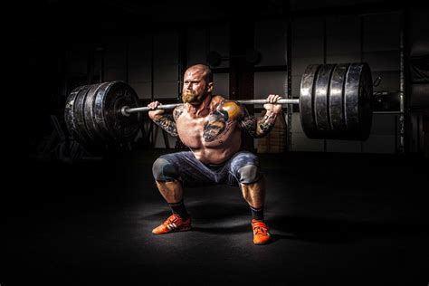 Power Lifter Doing Squats With Heavy Weights