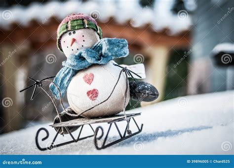 Snowman on a sled stock image. Image of holiday, scarf - 39896005