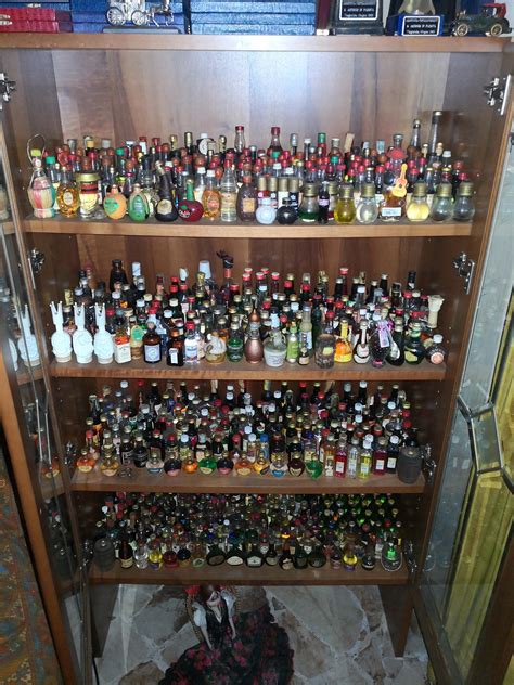 My grandfather's collection of mini bottles : r/liquor