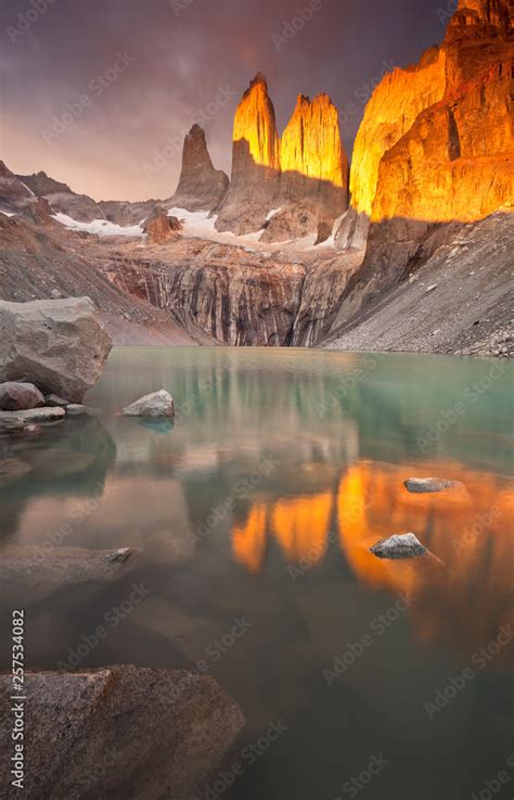 Sunrise on Torres del Paine's iconic towers. Stock Photo | Adobe Stock