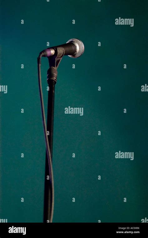 a microphone on stage Stock Photo - Alamy