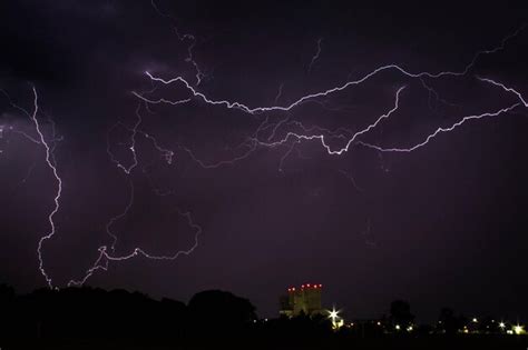 Premium Photo | Lightning in sky over city at night