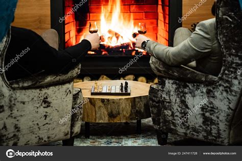 Men Drinking Wine Fireplace — Stock Photo © Shebeko #247411728