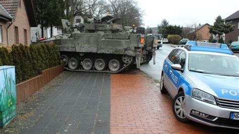 British 'tank' crashes into German couple's garden fence - BBC News