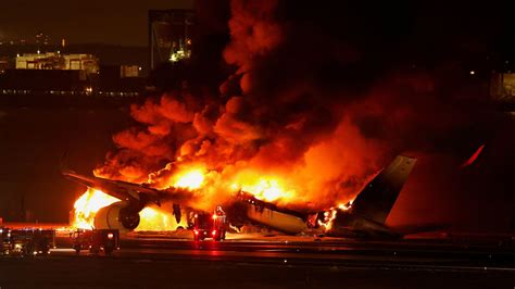 Japan Airlines jet bursts into flames