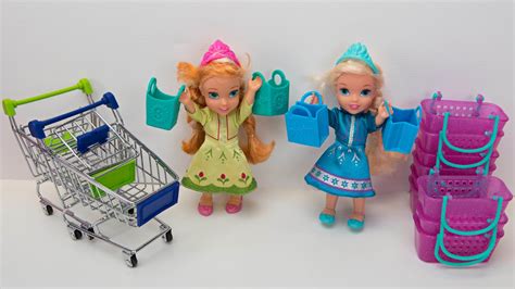 Elsa and Anna toddlers shopping for dolls – starkidslearn.com