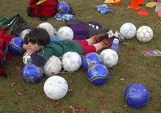 Owain and the soccer balls | Exhaustion, during a break. | Flickr