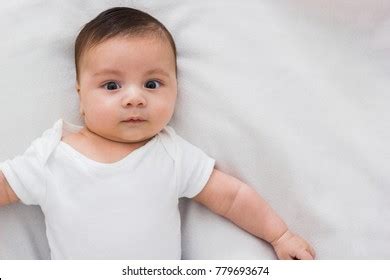 Adorable Baby Lying On Bed White Stock Photo (Edit Now) 779693668
