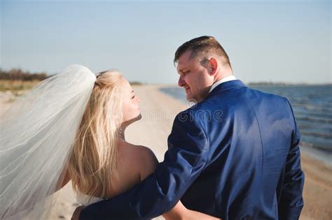 Couple in Love on the Beach on Their Wedding Day. Stock Image - Image ...