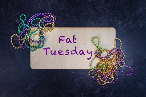 Fat Tuesday Wooden Design with Mardi Gras Beads Flat Lay Background ...