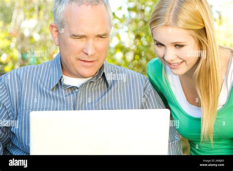 Happy family smiling Stock Photo - Alamy