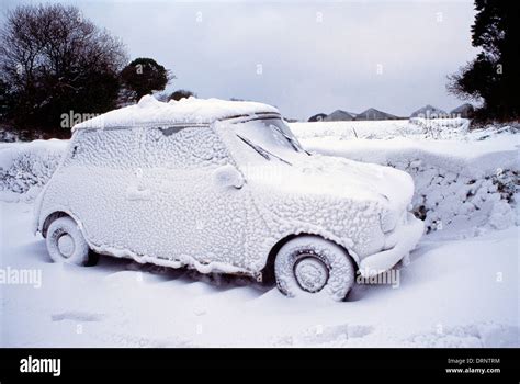 Guernsey. Winter scene with mini car stuck in snow drift Stock Photo - Alamy