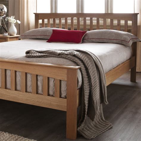 The Windsor - the light oak bedframe is finished with a wax, allowing ...