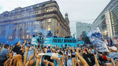 Man City celebrate historic treble with a parade in the rain - ESPN