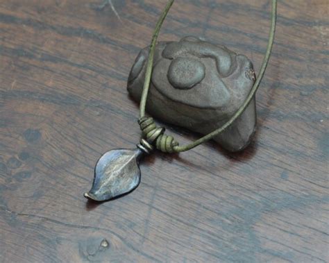 Iron Leaf Necklace a hand wrought leaf pendant on an by Taitaya