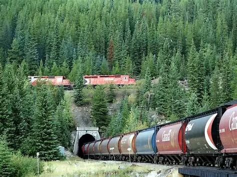 Canadian Pacific train passes over itself in the lower spiral tunnel in the Rocky Mountains of ...