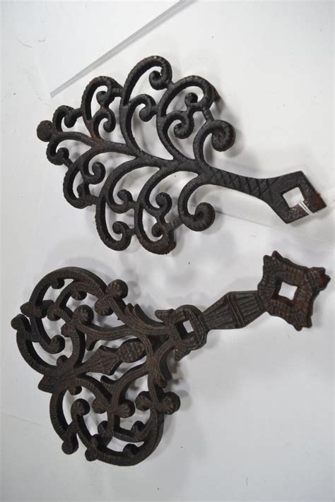 2 Vintage Decorative Cast Iron Trivets