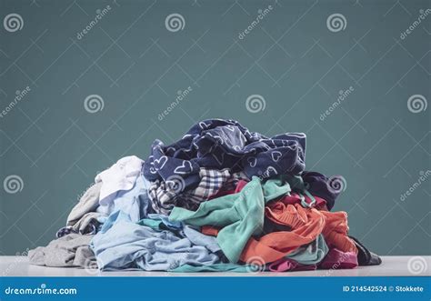 Heap of Crumpled Dirty Clothes Stock Photo - Image of hygiene, laundromat: 214542524