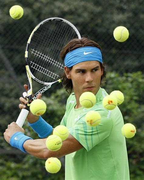 London, Britain An unreal WAX model of Rafael Nadal is surrounded by tennis balls at a tennis ...