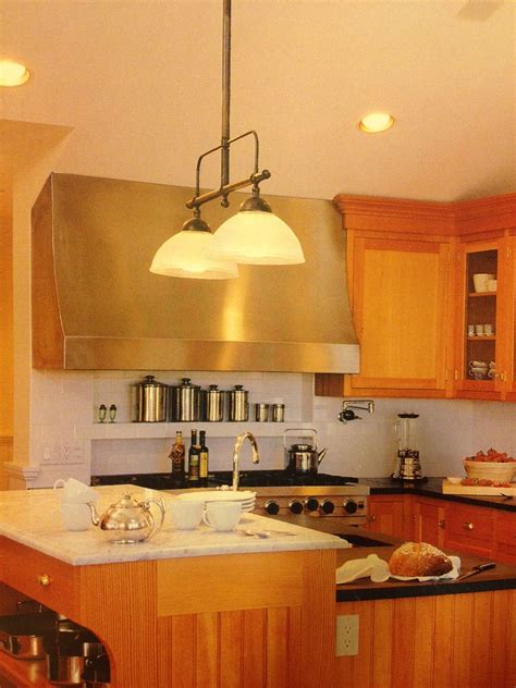 example of using a stainless steel kitchen hood. white subway tile back ...