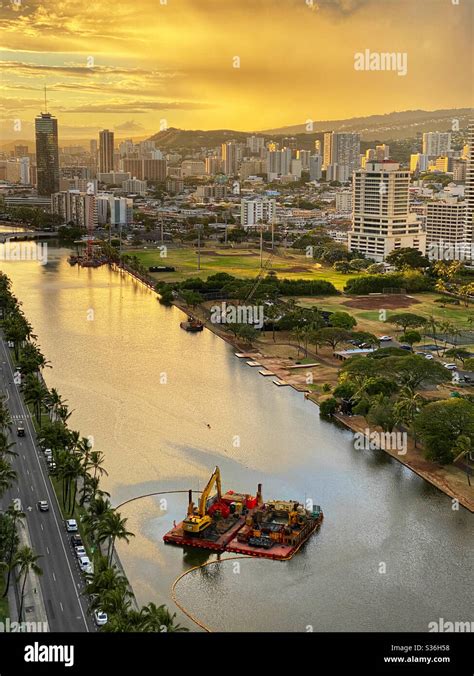 Dredging platform on the Ala Wai Canal in Honolulu, Hawaii at sunset ...