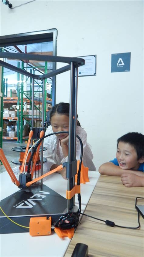 Kids watching 3D printer create 3D printed toys at Dagoma USA grand opening 3d Printing Business ...